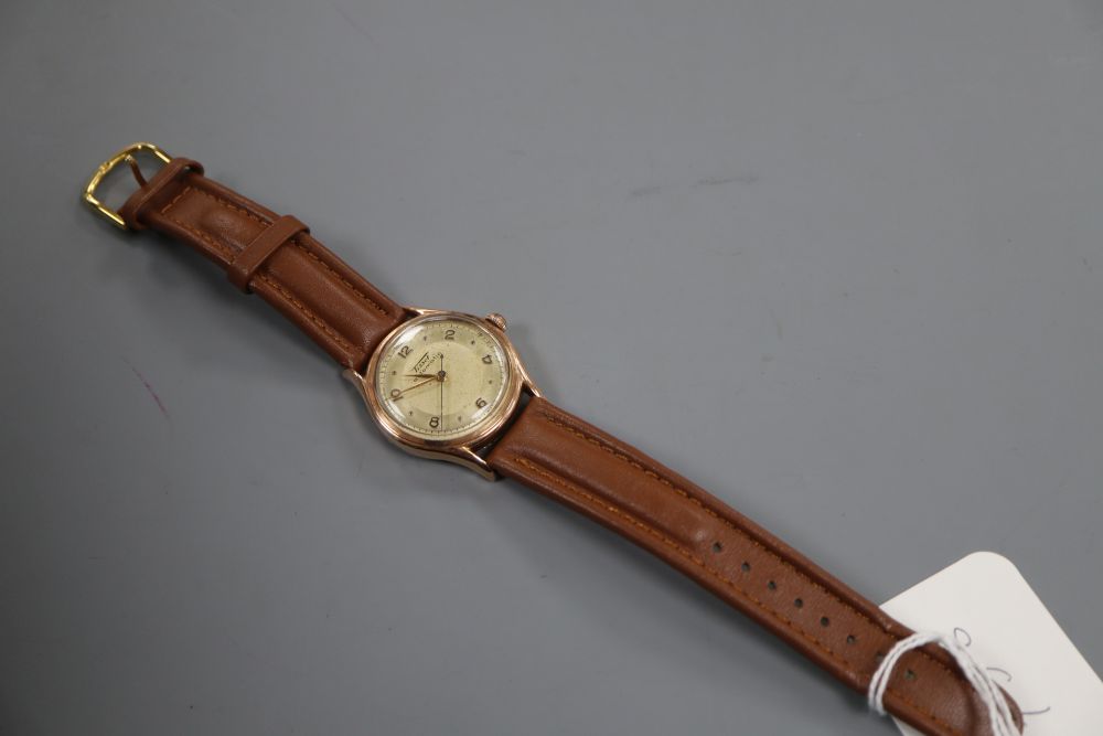 A gentlemans 14k Tissot automatic wrist watch, movement c.28.5.21, on later associated leather strap.